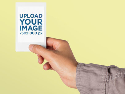 Mockup of an Instax Frame Picture Held Up Against a Colorful Backdrop 26175