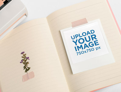 Mockup of a Polaroid Frame Scotch-Taped to an Open Notebook 26176