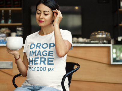 T-Shirt Mockup Featuring a Pregnant Woman at a Cafe a7963