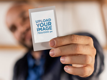Instax Frame Mockup of a Man Holding His Instant Picture