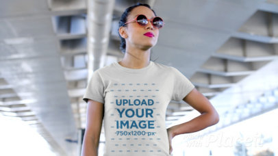 T-Shirt Video of a Rebel Girl Chewing Gum Under a Bridge 12829