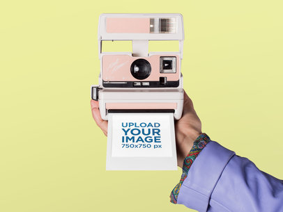 Mockup of a Polaroid Picture Frame Coming out of a Retro Camera