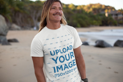 Mockup of a Cool Man Wearing a Tee on the Beach