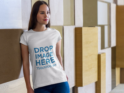Young Woman Leaning Against a Wall T-Shirt Mockup