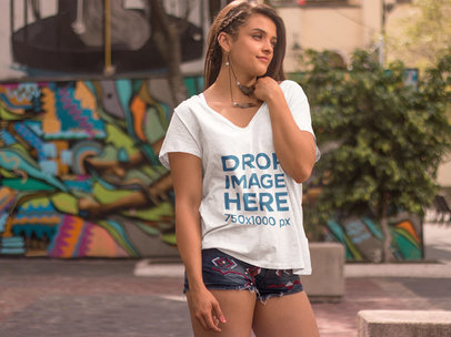 Hipster Woman Standing in Front of a Mural T-Shirt Mockup 