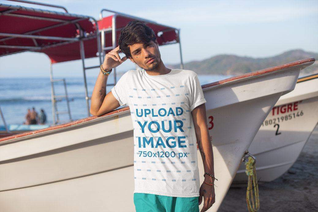 T-Shirt Mockup of a Man Leaning on a Panga Boat