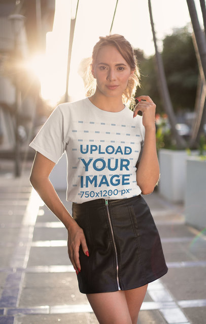 Mockup of a Stylish Woman Wearing a T-Shirt at Sunset