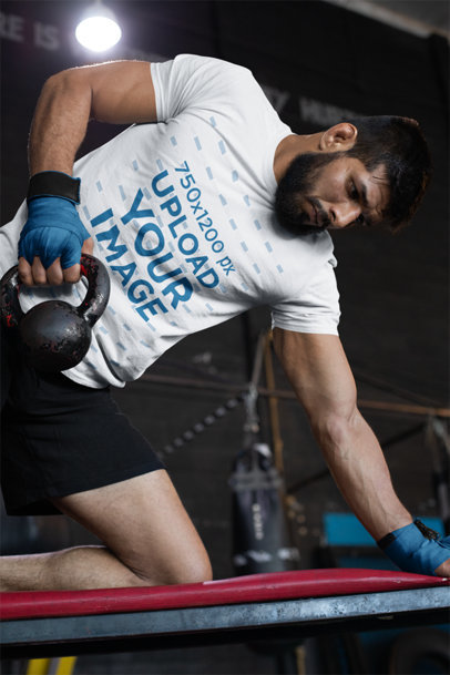 Tee Mockup of a Muscular Man Training at the Gym