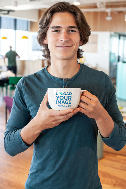 Mockup Featuring a Smiling Young Man Holding a Coffee Mug Close to Him 26503