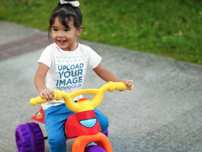 Little Girl Riding a Bicycle T-Shirt Mockup