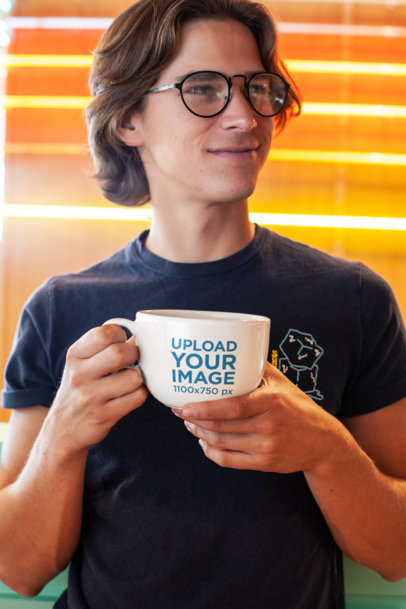 Mockup of a Young Man Holding a Big Coffee Mug 26509