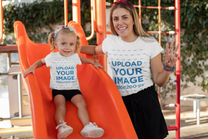 T-Shirt Mockup of a Little Girl and Her Mom Having Fun at a Playground