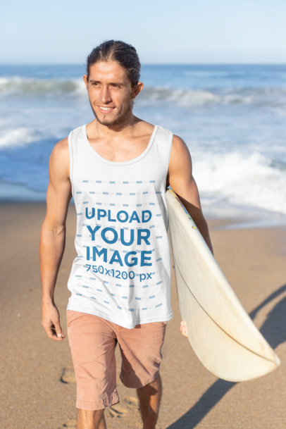 Tank Top Mockup of a Surfer Man Carrying His Board at the Beach
