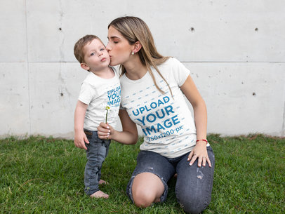 T-Shirt Mockup of a Young Mom Kissing Her Little Son at a Lawn