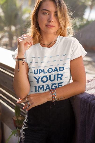 Tee Mockup Featuring a Blonde Young Woman near Some Palm Trees