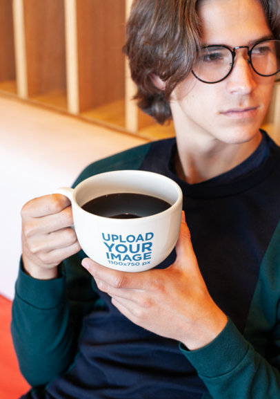 Coffee Mug Mockup of a Young Man with Blonde Hair and Trendy Glasses 26512