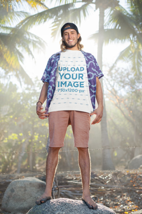 T-Shirt Mockup of a Beach-Attire Man Posing in the Light of Day