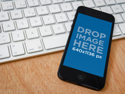 Mockup of an iPhone Placed on a Keyboard