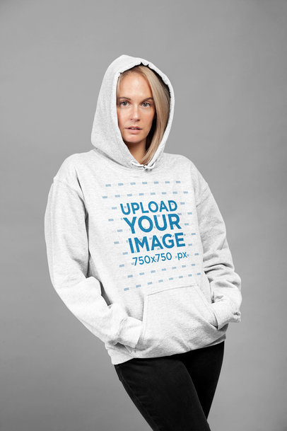 Mockup of a Woman Wearing a Heather Hoodie at a Studio