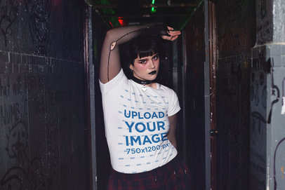 T-Shirt Mockup of a Goth Woman Posing in a Dark Corridor
