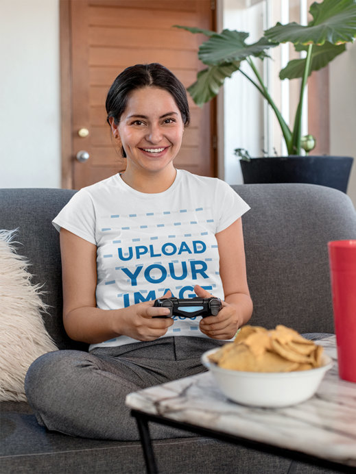 T-Shirt Mockup of a Gamer Woman Sitting Next to a Plate of Nachos