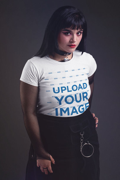 T-Shirt Mockup of a Goth Woman with Fishnet Sleeves at a Studio