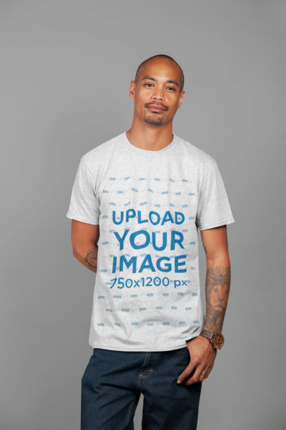 T-Shirt Mockup of a Tattooed Man at a Studio