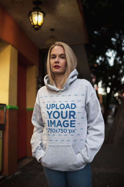 Mockup of a Blonde Woman Wearing a Heather Hoodie