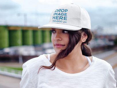 Hat Mockup of a Woman Standing on a Balcony 