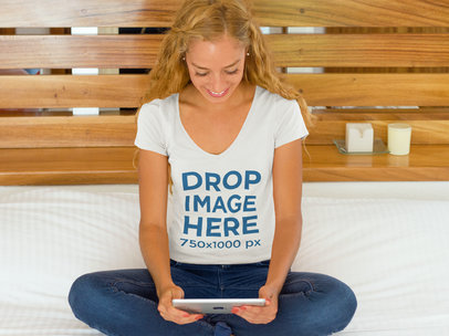 Smiling Woman in Bed Using an iPad T-Shirt Mockup