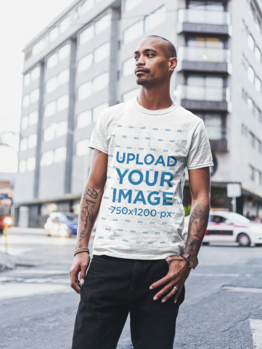 Heather T-Shirt Mockup of a Bearded Tattooed Man Standing by the Street
