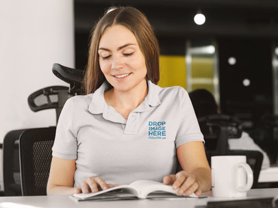 Polo Shirt Mockup of a Woman Reading a Book at the Office a8203