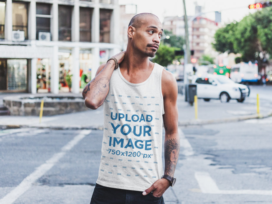 Mockup of a Buzz-Cut Man Wearing a Tank Top by the Street