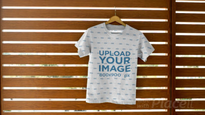 Tee Video Maker Featuring a T-Shirt Hanging on a Wall