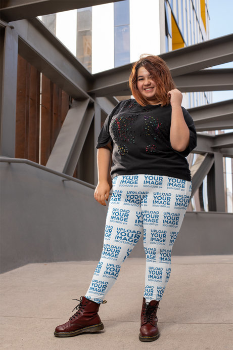 Mockup of a Smiling Woman Wearing Plus Size Leggings in an Urban Scenario