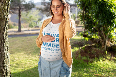 T-Shirt Mockup of a Pregnant Woman at a Park