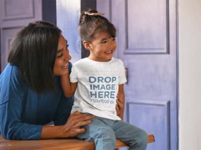 T-Shirt Mockup of a Girl Sitting on a Kitchen Counter