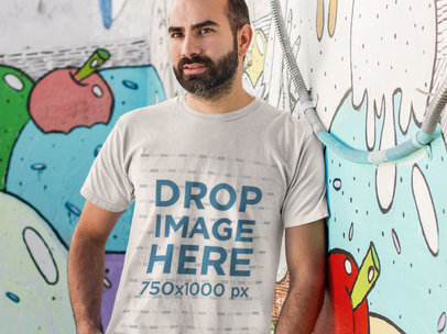 Man Standing in Front of a Graffiti Wall T-Shirt Mockup