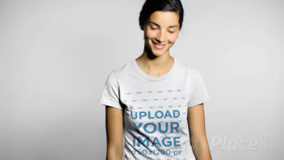 T-Shirt Video of a Smiling Woman Against a White Wall