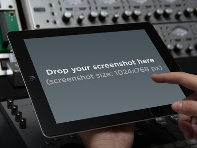 Mockup of a Man Using an iPad in a Music Studio