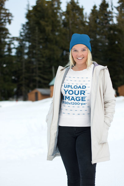 Sweatshirt Mockup of a Woman Wearing Casual Winter Attire in the Snow
