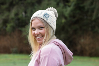 Beanie Mockup of a Smiling Woman at the Forest