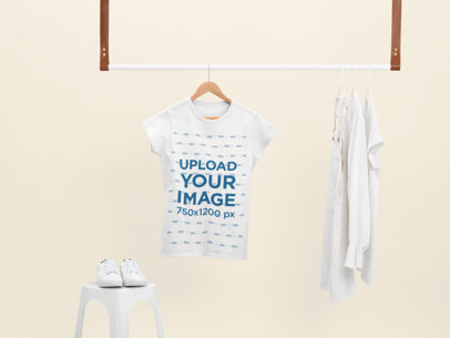 Mockup of a Women's T-Shirt Hanging With Only White Clothes