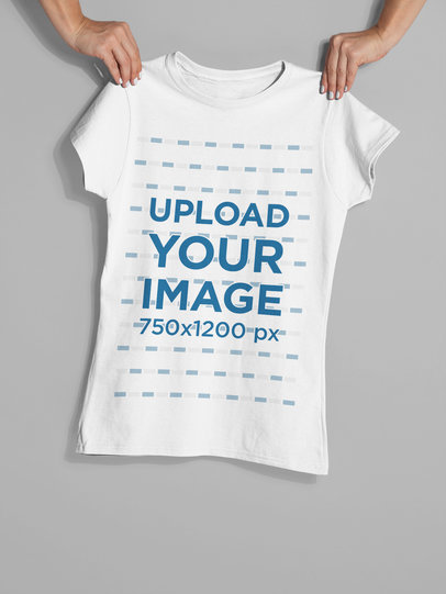 Mockup of Two Hands Holding a Women's T-Shirt