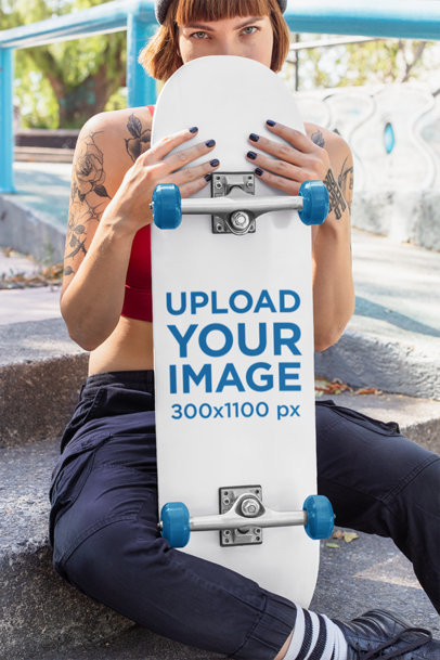 Skateboard Mockup Featuring a Tattooed Skater Woman 