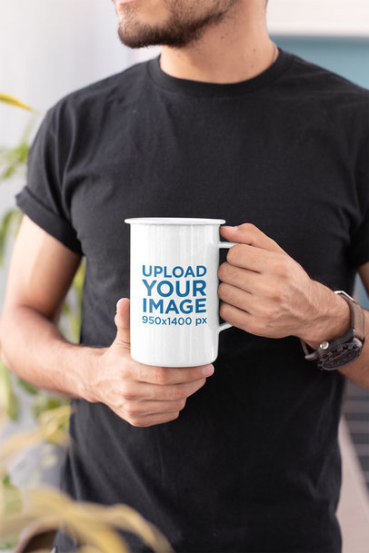 Mockup of a Young Man Holding a 21 Oz Enamel Mug  26932