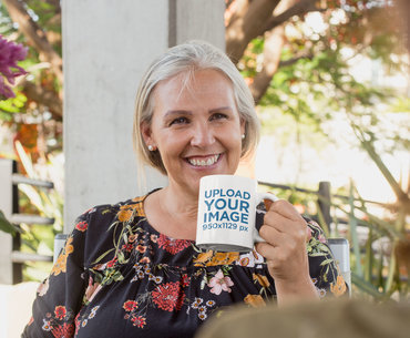 11 Oz Mug Mockup of a Senior Woman Having a Coffee