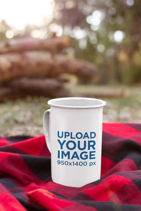 Mockup of a 21 Oz Enamel Mug on a Checkered Blanket