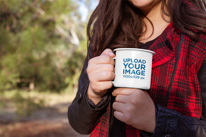 Mockup of a Woman with Long Hair Holding a 12 Oz Enamel Mug