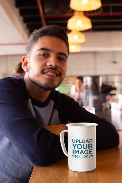 Mockup of a 21 Oz Mug over a Countertop Next to a Smiling Man 26938a